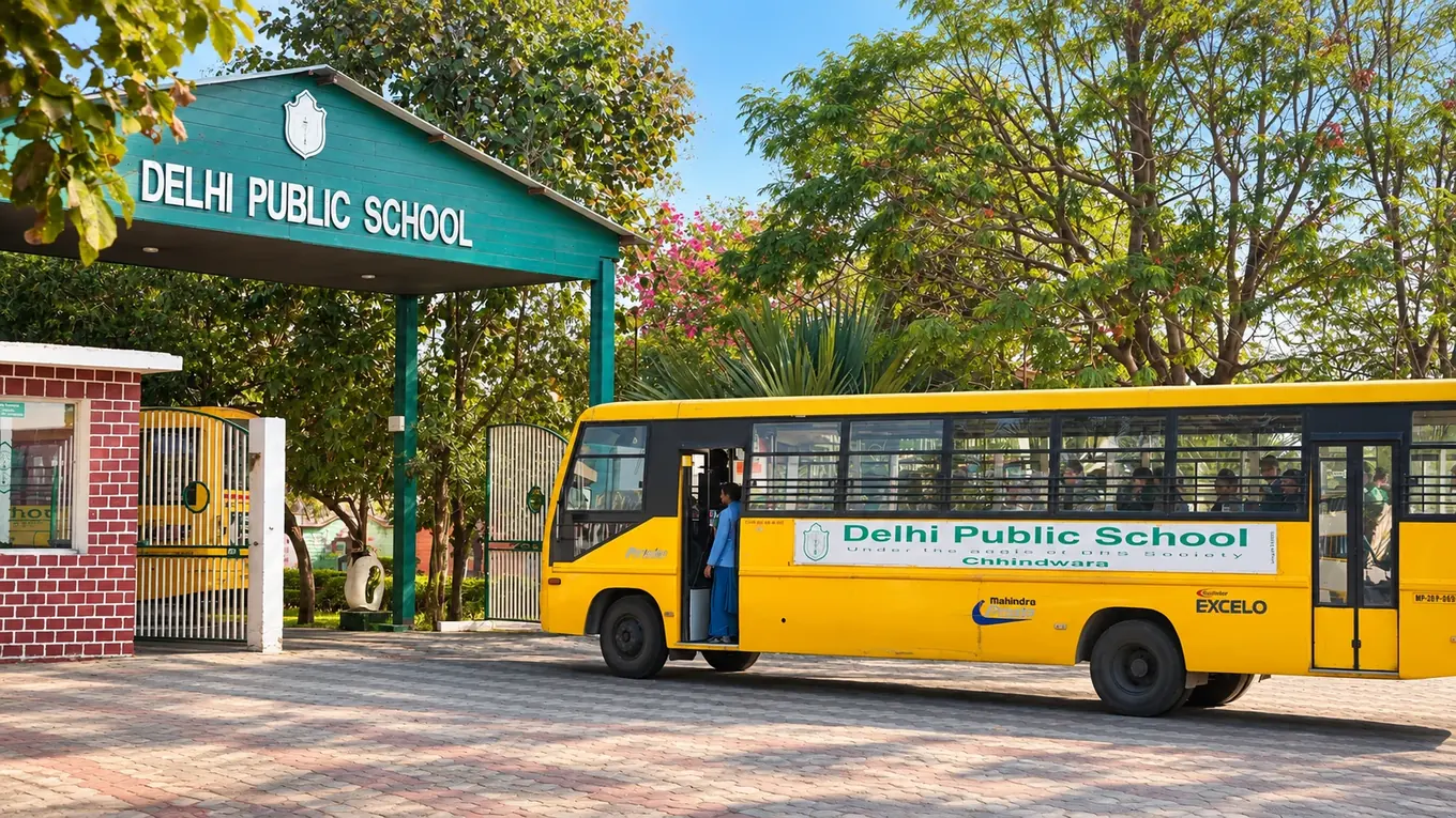 The entrance of Delhi Public School Chhindwara with a school bus