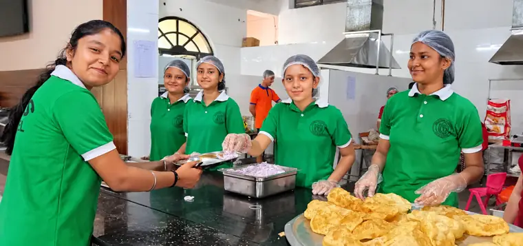 Boarders cooking together in the school kitchen at DPS Chhindwara