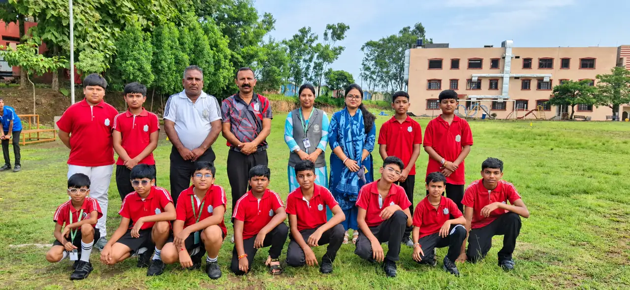 A house team with teachers on the ground at Delhi Public School Chhindwara