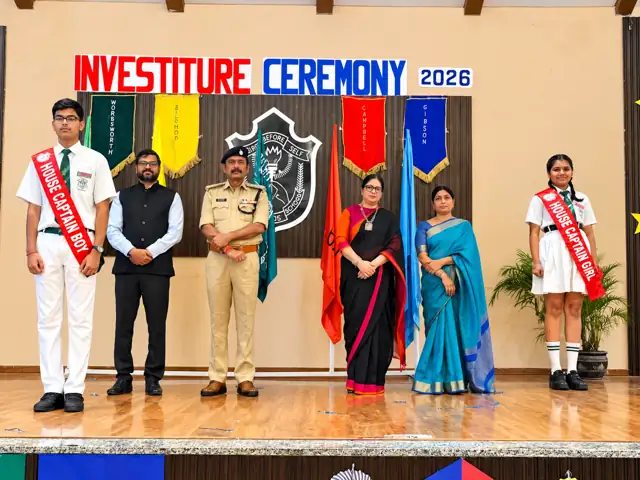 Head Boy and Head Girl with guests at the Investiture Ceremony, Delhi Public School Chhindwara