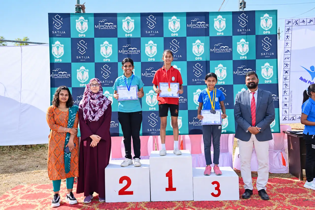 Students on the winners' podium, Delhi Public School Chhindwara