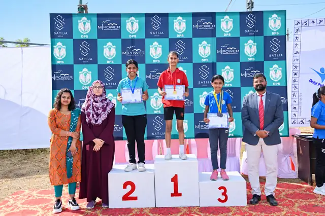Students on the winners' podium, Delhi Public School Chhindwara