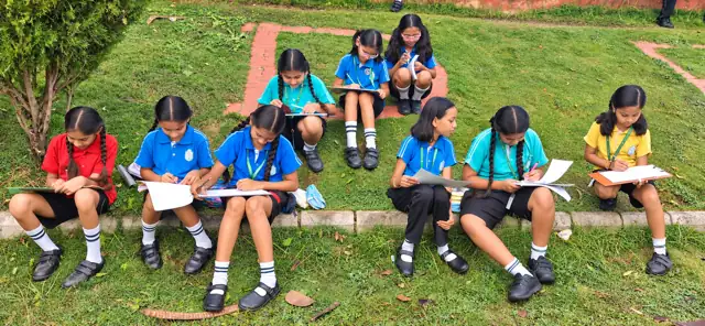 Students sketching outdoors on the campus of Delhi Public School Chhindwara
