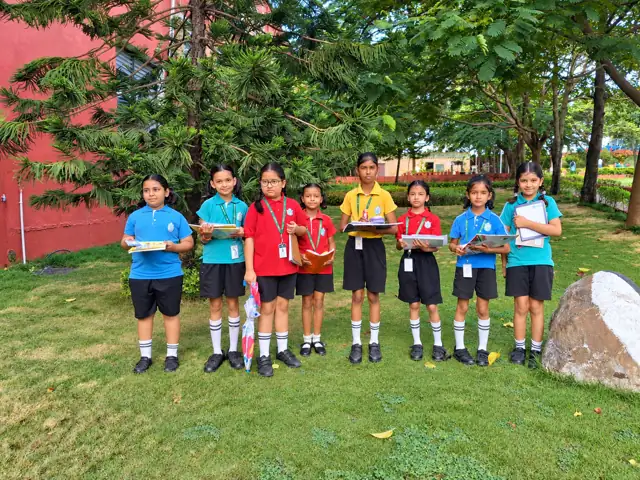 Students showing their nature sketches at Delhi Public School Chhindwara