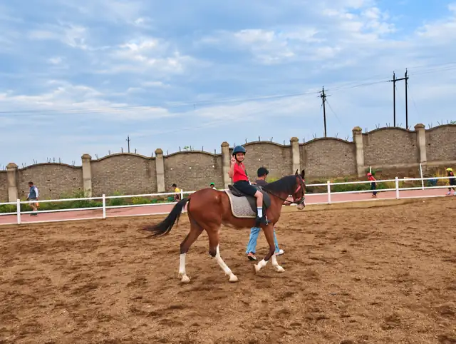 A student riding in the horse riding arena at Delhi Public School Chhindwara