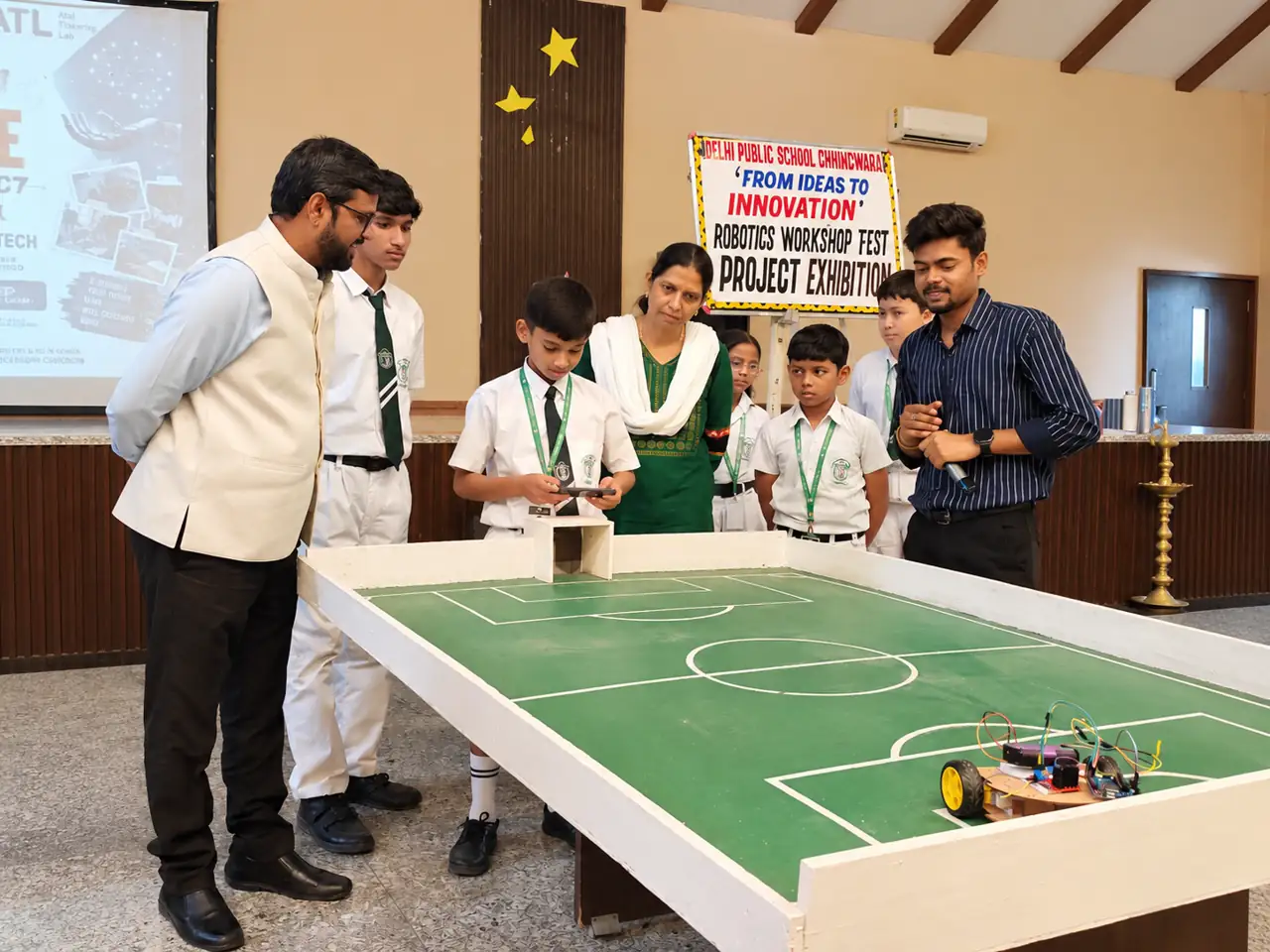 Students presenting a robotics project at Delhi Public School Chhindwara