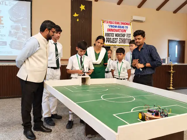 Students presenting a robotics project at Delhi Public School Chhindwara