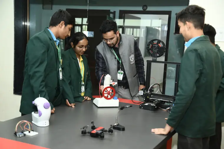 Students working on robotics and drones with their teacher at DPS Chhindwara
