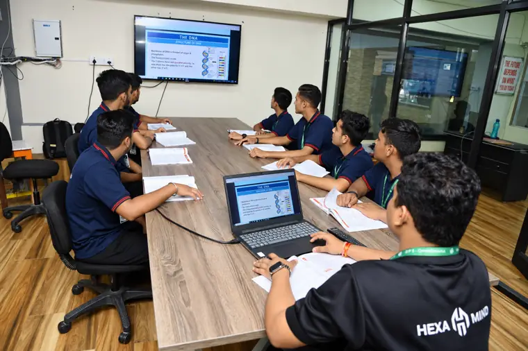 HexaMind students working on laptops during a senior-class session at DPS Chhindwara